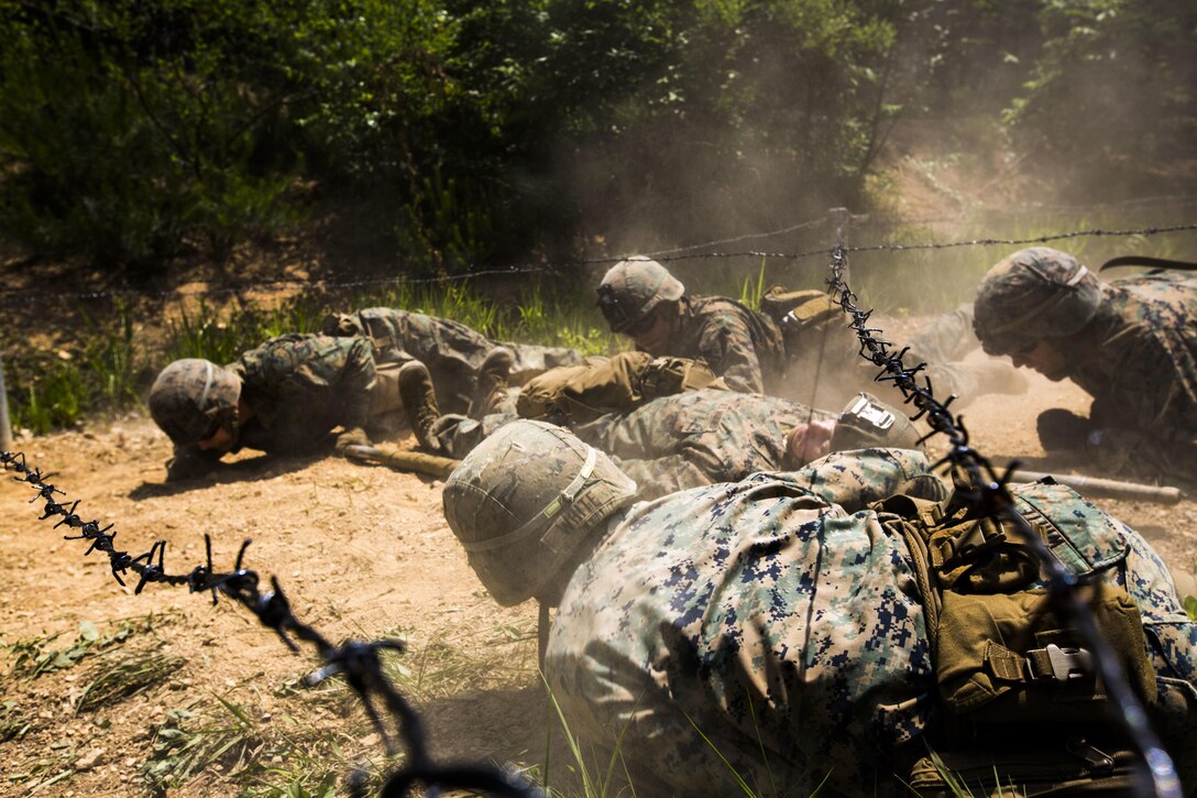 U.S. Marines and Sailors assigned to India Company, 3rd Battalion, 8th Marine Regiment, forward deployed to the 3rd Marine Division, as part of the forward Unit Deployed Program, practice small-unit leadership skills through a Leadership Reaction Course at Camp Mujuk, South Korea, May 29, 2017. Marines conduct courses like these to build confidence and communication skills within their units. (U.S. Marine Corps photo by Cpl. David A. Diggs)