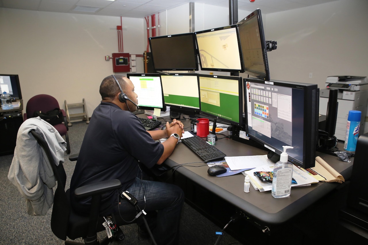 An emergency dispatcher uses the newly-installed Consolidated Emergency Response System emergency dispatcher workstation aboard Marine Corps Base Quantico, Va.  CERS aggregates multiple capabilities—Enhanced 911, Computer-Aided Dispatch, and fire station alerting—into a single workstation, giving emergency dispatchers the ability to quickly dispatch the appropriate assets where necessary. CERS increases the effectiveness of emergency response operations aboard Marine Corps installations worldwide. (U.S. Marine Corps photo by Ashley Calingo)