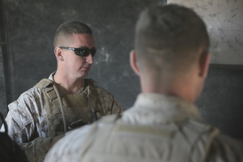 Staff Sgt. Travis J. Zurick, field artillery chief with Battery D, 2nd Battalion, 14th Marines Regiment, 4th Marine Division, Marine Forces Reserve participate in a meeting prior to a mission simulation during his unit annual training at Dugway Proving Grounds, Utah, June 12, 2017. Throughout the days, the Marines participated in multiple operations and evaluated qualification exercises to include; machine guns, grenades and rifle ranges, live fire and night convoy operations, battery movement in small arms ranges and artillery operations. (U.S. Marines Corps photo by Sgt. Ian Ferro)