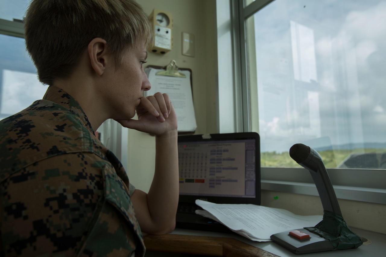 Sgt. Krista Marshik waits to call the next command at the Combat Pistol Program tower, on Camp Hansen, Okinawa, Japan, June, 5, 2017. Marshik voices the CPP tower to ensure all guidelines and saftey rules on the range are met. Marshik, a native of Arden Hills, Minnesota, is an ammunition technician with the Formal Marksmanship Training Unit, III Marine Expeditionary Force. (U.S. Marine Corps photo by Lance Cpl. Charles Plouffe)