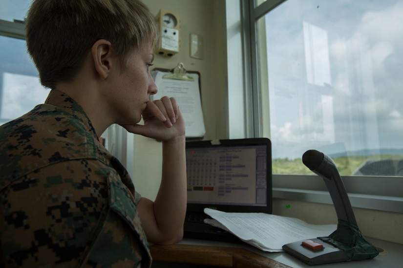 Sgt. Krista Marshik waits to call the next command at the Combat Pistol Program tower, on Camp Hansen, Okinawa, Japan, June, 5, 2017. Marshik voices the CPP tower to ensure all guidelines and saftey rules on the range are met. Marshik, a native of Arden Hills, Minnesota, is an ammunition technician with the Formal Marksmanship Training Unit, III Marine Expeditionary Force. (U.S. Marine Corps photo by Lance Cpl. Charles Plouffe)