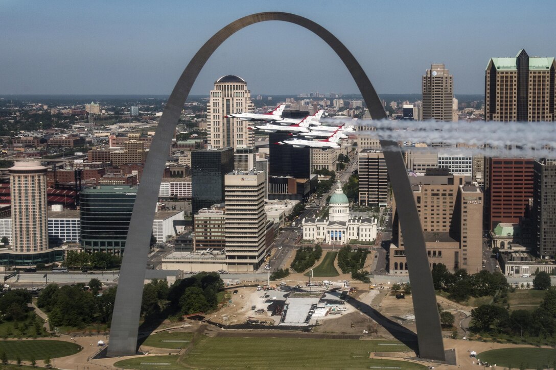 The Thunderbirds, the Air Force flight demonstration squadron, fly by the Gateway Arch in St. Louis, June 12, 2017, while returning to Nellis Air Force Base, Nev. Air Force photo by Tech. Sgt. Christopher Boitz