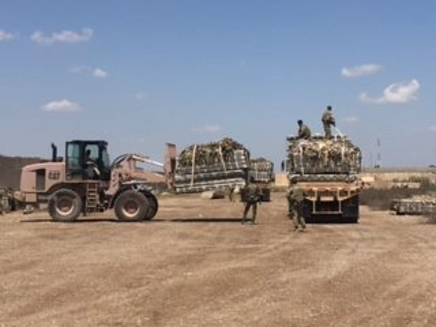 Members of the Iraqi air force and the U.S. Army 574th Combat Support Command work together to load recovered 463L pallets onto an U.S. Army truck at Al Muthana Air Base, Iraq, April 16, 2017. The pallet recovery initiative, led by aerial porters at the Baghdad Diplomatic Support Center, Iraq, involved the recovery of more than 1,500 aircraft pallets and 1,600 cargo nets, which were used for foreign military sales cargo destined for the Iraqi military to fight ISIS in Mosul. (U.S. Air Force courtesy photo)