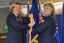 Brig. Gen. Ellen Moore (left), the HQ ARPC commander, passes the HQ RIO guidon to the organization&#39;s new commander, Col. Kelli B. Smiley, during a change of command ceremony, June 12. Smiley comes to HQ RIO after previously serving as the director of Total Force Services at HQ ARPC, which is responsible for providing personnel support to over 1 million Air Force Reserve, Air National Guard and retired Airmen.