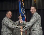 U.S. Air Force Col. Steven Zubowicz, 52nd Mission Support Group commander, left, gives the ceremonial guidon to U.S. Air Force Lt. Col. Steven Lovett, incoming 52nd Security Forces Squadron commander, during the 52nd SFS change of command ceremony on Spangdahlem Air Base, Germany, June 13, 2017. (U.S. Air Force photo by Joshua Kodis)