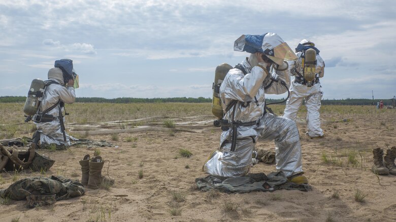 Crash Fire Rescue Marines with Marine Wing Support Squadron 473, 4th Marine Aircraft Wing, Marine Forces Reserve, practice putting on their protective equipment during a simulated fire drill at Canadian Forces Base Cold Lake during exercise Maple Flag, June 1, 2017. Three geographically separate MWSS-473 detachments came together to participate in exercise Maple Flag May 29-June 23, 2017, during their annual training.