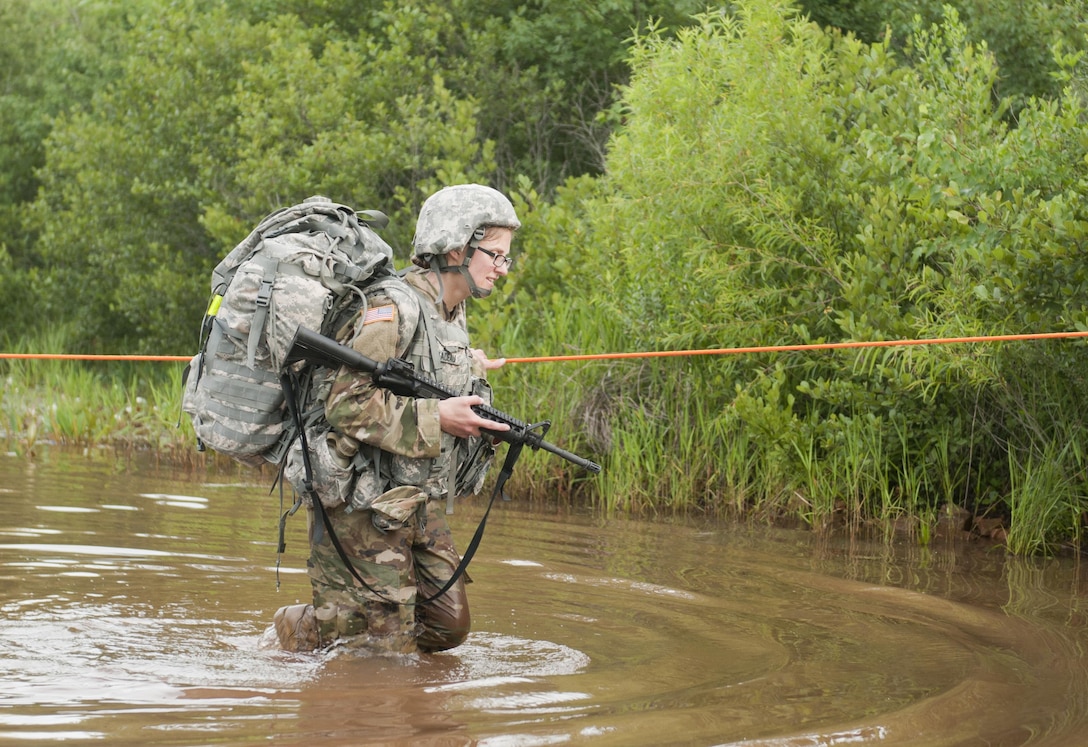 Sgt. Erin Nadeau of Coral Springs, Fla. and a preventative medicine specialist representing the 7th Medical Support command, crosses a water obstacle at the 2017 U.S. Army Reserve Best Warrior Competition at Fort Bragg, N.C. June 13. This year’s Best Warrior Competition will determine the top noncommissioned officer and junior enlisted Soldier who will represent the U.S. Army Reserve in the Department of the Army Best Warrior Competition later this year at Fort A.P. Hill, Va. (U.S. Army Reserve photo by Sgt. David Turner) (Released)