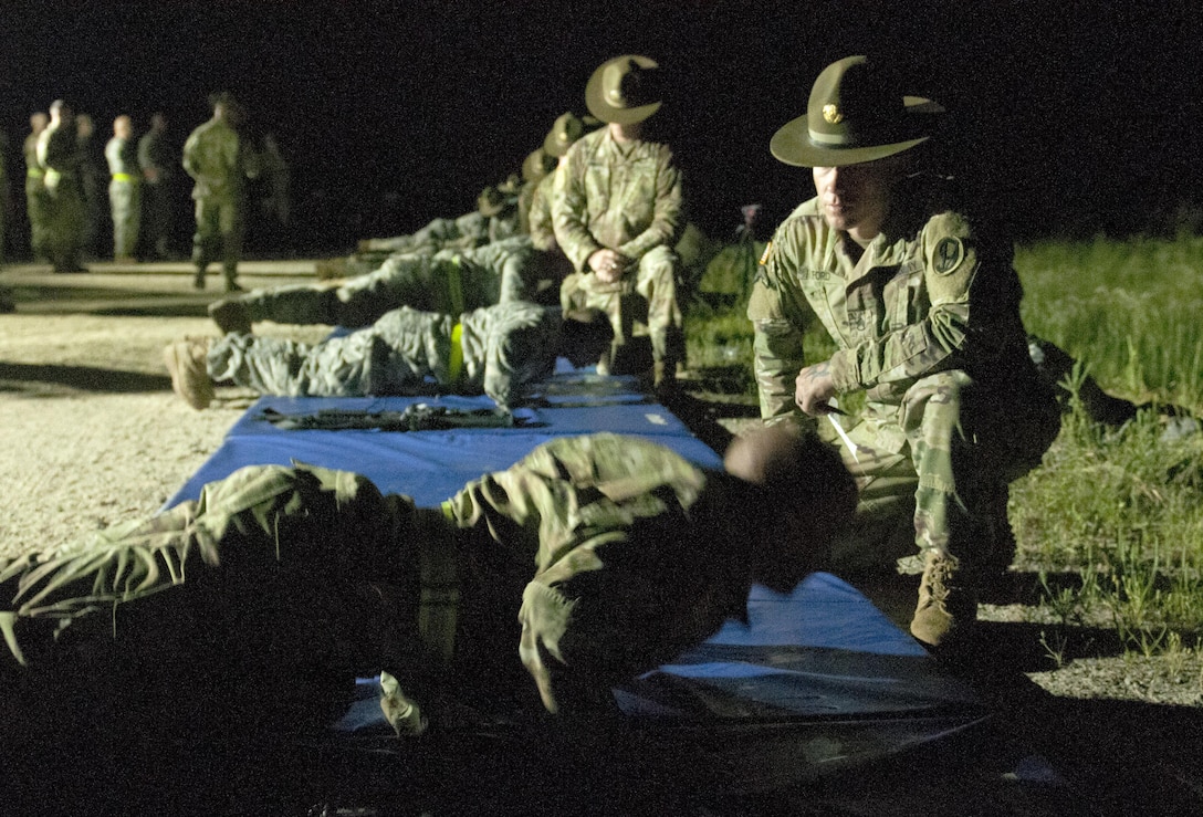 Army Reserve drill sergeants from the 95th Training Command administer an early-morning, surprise physical fitness test to the Warriors competing at the 2017 U.S. Army Reserve Best Warrior Competition at Fort Bragg, N.C. June 13. This year’s Best Warrior Competition will determine the top noncommissioned officer and junior enlisted Soldier who will represent the U.S. Army Reserve in the Department of the Army Best Warrior Competition later this year at Fort A.P. Hill, Va. (U.S. Army Reserve photo by Sgt. David Turner) (Released)