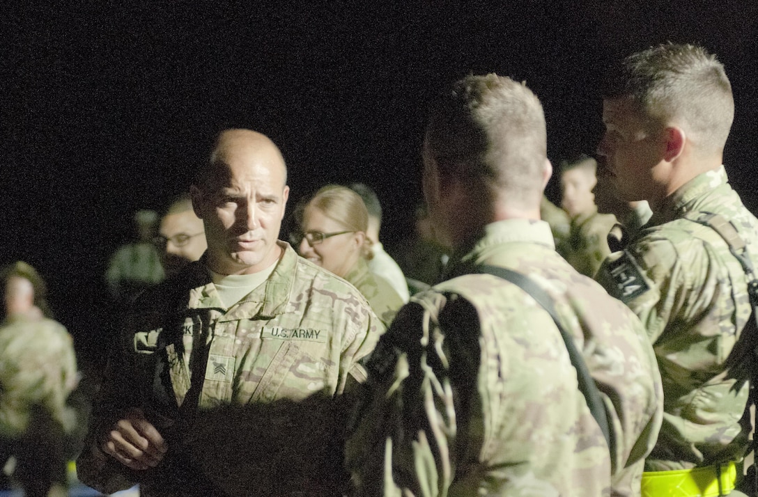Sgt. David Blalock, of Wolf City, Texas (left), representing the 75th Training Command, prepares to take a surprise, early-morning physical fitness test at the beginning of the 2017 U.S. Army Reserve Best Warrior Competition at Fort Bragg, N.C. June 13. At 44, Blalock is the oldest Warrior in this year’s Best Warrior Competition, which will determine the top noncommissioned officer and junior enlisted Soldier who will represent the U.S. Army Reserve in the Department of the Army Best Warrior Competition later this year at Fort A.P. Hill, Va. (U.S. Army Reserve photo by Sgt. David Turner) (Released)