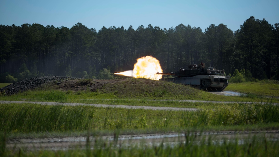 U.S. Marines with Alpha Company, 2nd Tank Battalion, 2d Marine Division (2D MARDIV), fires the main gun during the 14th annual Tiger Competition (TIGERCOMP) at SR-10 range on Camp Lejeune, N.C., June 9, 2017. The purpose of TIGERCOMP is to test each Marine tank crew’s decision-making abilities, communication, technical proficiency and cohesiveness while operating the M1A1 Abrams tank. 