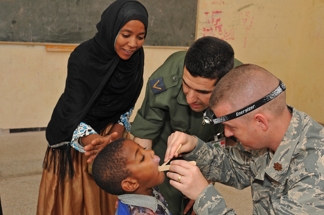 Maj. Kevin Loveridge, a physician assistant with the 151st Medical Group, provides medical care in conjunction with  Moroccan counterparts in Akka Ighane, Morocco on April 21, 2017. (U.S. Air National Guard photo by Tech. Sgt. Annie Edwards)