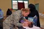 Maj. Amy Prince, a flight surgeon with the 140th Medical Group, provides medical care in the pediatric clinic in Adis, Morocco on April 22, 2017. (U.S. Air National Guard photo by Tech. Sgt. Annie Edwards)