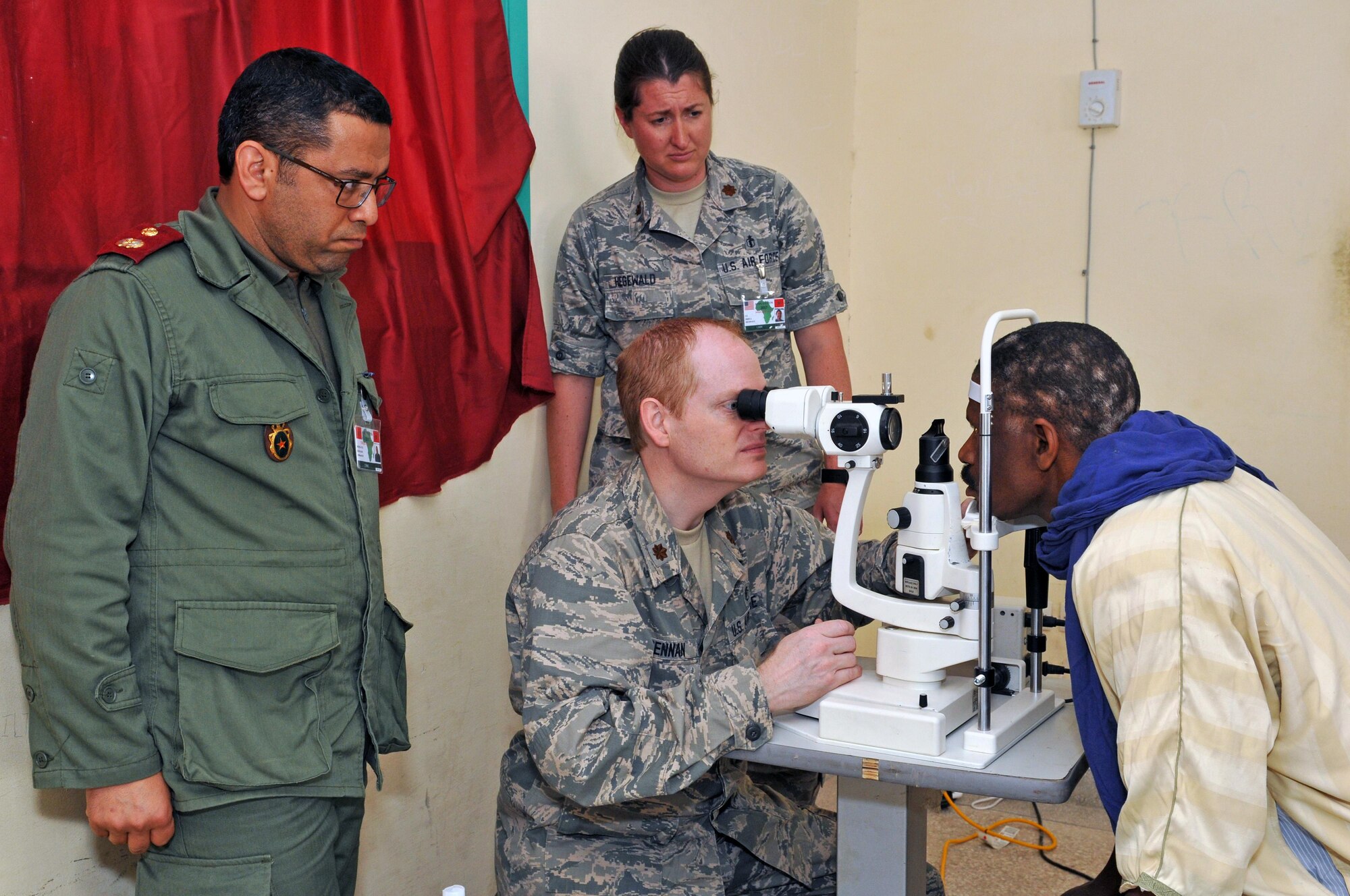 Maj. Kirk Drennan, an optometrist with the 151st Medical Group and Maj. Jessica Hegewald, an optometrist with the 140th Medical Group, provide medical care in Adis, Morocco on April 22, 2017. (U.S. Air National Guard photo by Tech. Sgt. Annie Edwards)