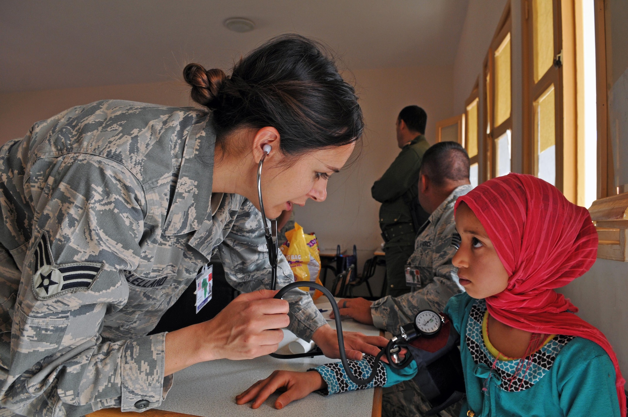 Senior Airman Holly Mclelland, a medical technician with the 151st Medical Group takes the blood pressure of a patient at the clinic in Tagmout, Morocco on April 23, 2017. (U.S. Air National Guard photo by Tech. Sgt. Annie Edwards)