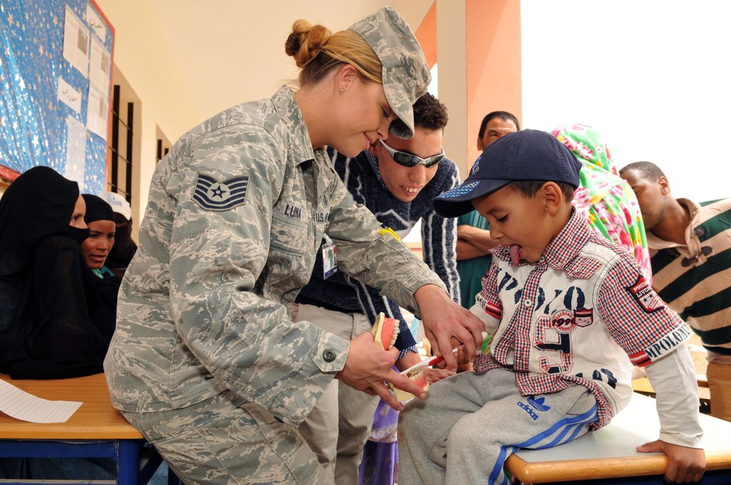 Tech. Sgt. Christina Luna, a dental technician with the 140th Medical Group provides oral hygiene education to dental patients and members of the local population at Tagmout, Morocco on April 23, 2017. (U.S. Air National Guard photo by Tech. Sgt. Annie Edwards)