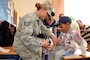 Tech. Sgt. Christina Luna, a dental technician with the 140th Medical Group provides oral hygiene education to dental patients and members of the local population at Tagmout, Morocco on April 23, 2017. (U.S. Air National Guard photo by Tech. Sgt. Annie Edwards)