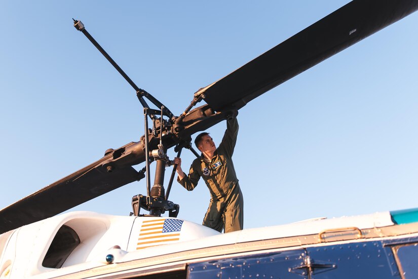 Capt. Erik Luttkus, 1st Helicopter Squadron UH-1N Iroquois pilot, inspects the blades of the helicopter at Joint Base Andrews, Md., June 9, 2017. The 1st HS conducted a flyover demonstration above the Air Force Memorial in Washington, D.C., in support of the U.S. Air Force Band’s Heritage to Horizons concert series. (U.S. Air Force photo by Senior Airman Delano Scott)    