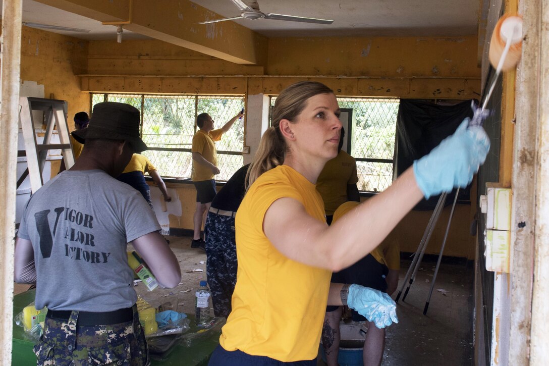 Navy Lt. Christina Appleman, who's assigned to the Ticonderoga-class guided missile cruiser USS Lake Erie, paints a classroom in the Mallika Nawodya School to support humanitarian assistance operations in Sri Lanka in the wake of severe flooding and landslides that devastated many regions of the country in Galle, Sri Lanka, June 14, 2017. Recent heavy rainfall brought by a southwest monsoon triggered flooding and landslides throughout the country, displacing thousands of people and causing significant damage to homes and buildings. Navy photo by Petty Officer 3rd Class Lucas T. Hans