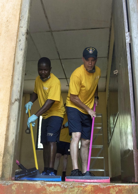 Navy Petty Officer 2nd Class Yao Koumekpo, left, and Navy Petty Officer 1st Class Matthew Baker, both assigned to the Ticonderoga-class guided missile cruiser USS Lake Erie, clean classrooms of the Mallika Nawodya School in Galle, Sri Lanka, June 14, 2017. the USS Lake Erie is in Sri Lanka to support humanitarian assistance operations in the wake of severe flooding and landslides that devastated many regions of the country. Recent heavy rainfall brought by a southwest monsoon triggered flooding and landslides throughout the country, displacing thousands of people and causing significant damage to homes and buildings. Navy photo by Petty Officer 3rd Class Lucas T. Hans