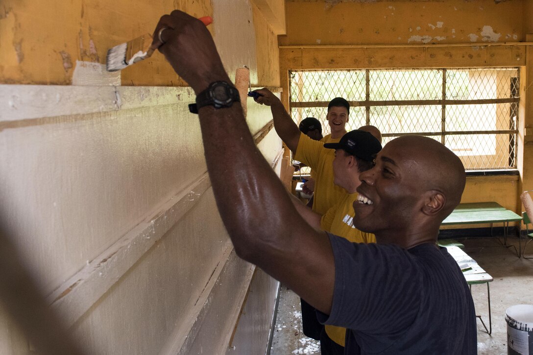 Navy Capt. Lex Walker, commodore of Destroyer Squadron 7, paints classrooms with sailors assigned to the Ticonderoga-class guided-missile cruiser USS Lake Erie at the Mallika Nawodya School in Sri Lanka during a community engagement event in support of humanitarian assistance operations in the wake of severe flooding and landslides that devastated many regions of the country near Galle, Sri Lanka, June 14, 2017. Recent heavy rainfall brought by a southwestern monsoon triggered flooding and landslides throughout the country, displacing thousands of people and causing significant damage to homes and buildings. Navy photo by Petty Officer 2nd Class Joshua Fulton