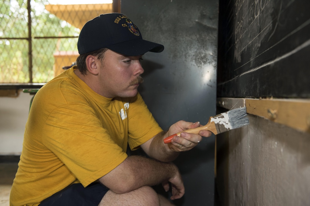 Navy Petty Officer 3rd Class Kyle Jeppe, who's assigned to the Ticonderoga-class guided-missile cruiser USS Lake Erie, paints classrooms at the Mallika Nawodya School in Sri Lanka during a community engagement event in support of humanitarian assistance operations in the wake of severe flooding and landslides that devastated many regions of the country near Galle, Sri Lanka, June 14, 2017. Recent heavy rainfall brought by a southwestern monsoon triggered flooding and landslides throughout the country, displacing thousands of people and causing significant damage to homes and buildings. Navy photo by Petty Officer  2nd Class Joshua Fulton