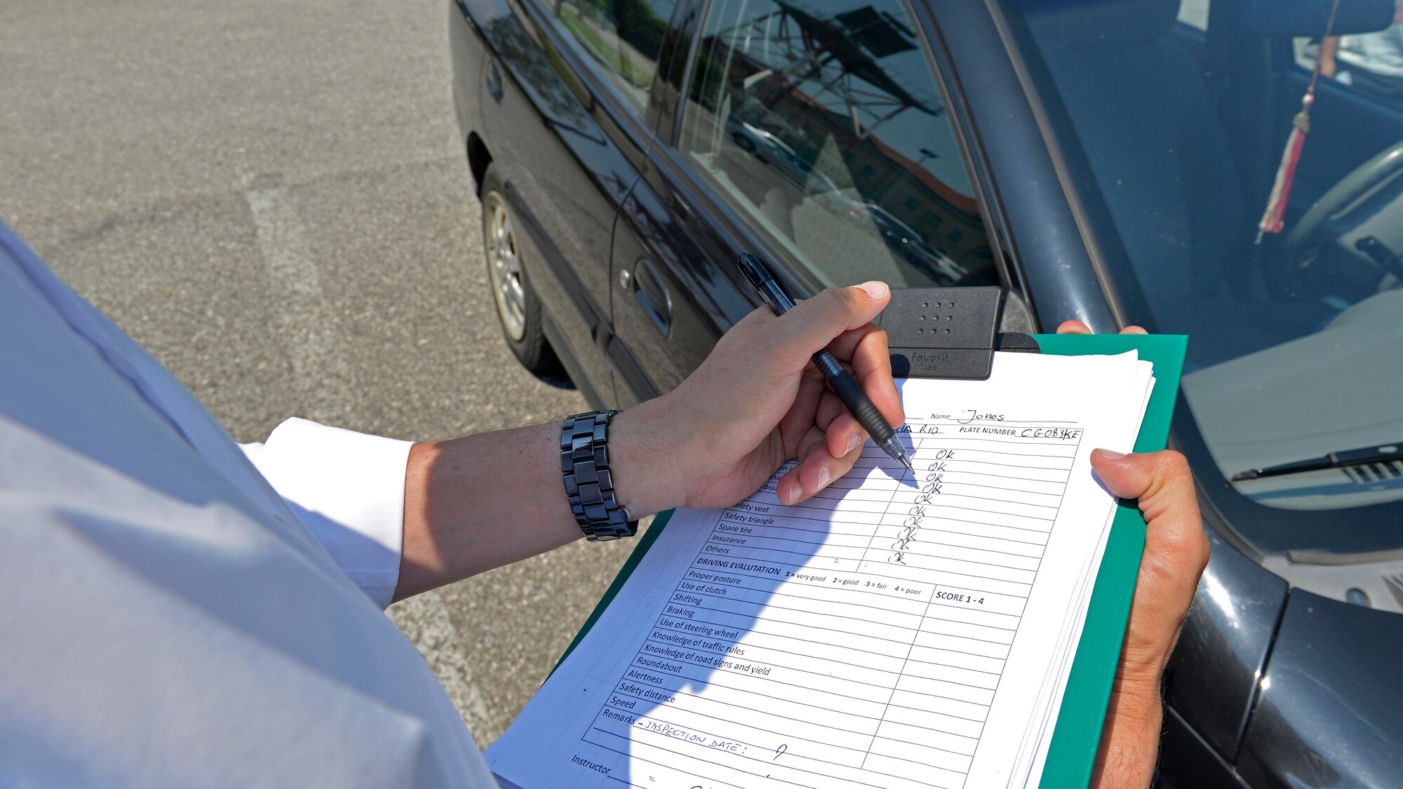 Stefano Marazzi, contracted driving instructor, performs a vehicle inspection as part of hands-on driving course, June 13, 2017 at Aviano Air Base, Italy. Marazzi evaluates both the vehicle and driver’s performance and provides the results to the 31st Fighter Wing safety office. (U.S. Air Force photo by Senior Airman Cary Smith)