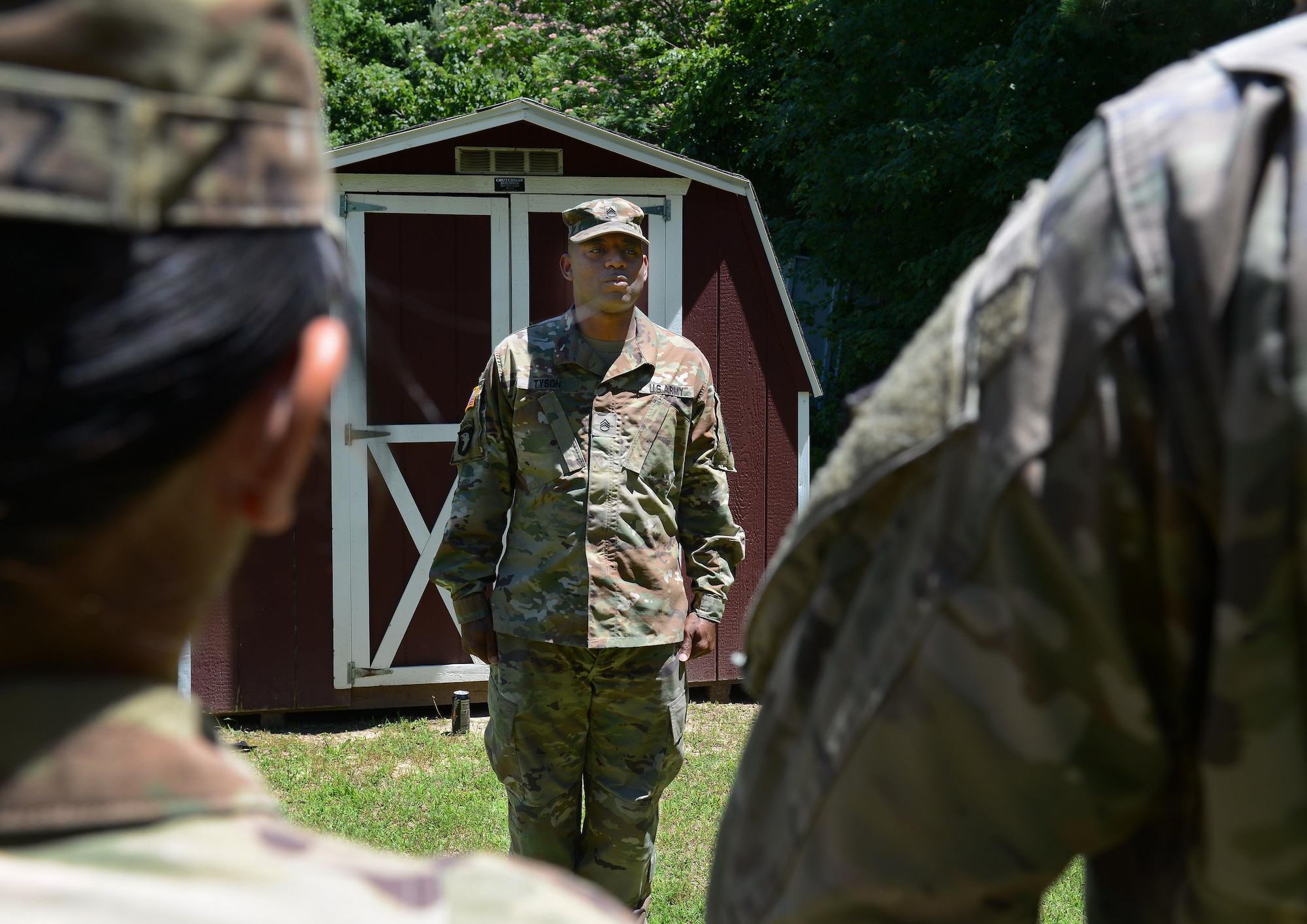 U.S. Army Staff Sgt. Darryl Tyson, 149th Seaport Operations Company, 10th Transportation Battalion, 7th Transportation Brigade (Expeditionary) cargo specialist and Fort Eustis Color Guard NCO in charge, gives commands and critiques to members of the Ft. Eustis Color Guard as they practice presenting and posting the colors for a ceremony at Joint Base Langley-Eustis, Va., June 9, 2017. Each quarter, a different battalion within the 7th Trans. Bde. (Ex.) provides Soldiers to lead the color guard, allowing Soldiers from various jobs to step outside their career fields and work together to accomplish the mission. (U.S. Air Force photo/Staff Sgt. Teresa J. Cleveland)
