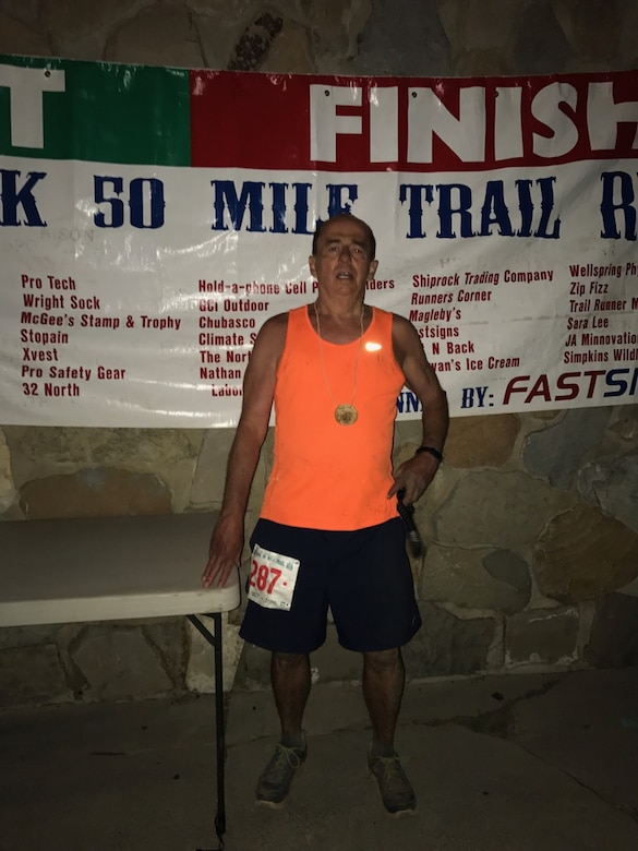 PROVO CANYON, Utah – Al Strait, 21st Space Wing director of staff, stands at the finish line after completing the Squaw Peak 50 Mile Adventure Run in Provo Canyon, Utah, June 3, 2017. Strait, 64, endured 50 miles of extreme terrain and elevation changes during the 18 hours it took to complete. (Courtesy photo)