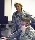 Col. DeAnna Burt, 50th Space Wing Commander, gives Senior Airman Brandon Myers, 2nd Space Operations Squadron satellite system operator, the final command to decommission satellite 32 at Schriever Air Force Base, Colorado, Monday, June 12, 2017. SVN 32 orbited Earth for 24 years.  (U.S. Air Force photo/Airman 1st Class William Tracy)