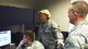 Col. DeAnna Burt, 50th Space Wing Commander, gives Senior Airman Brandon Myers, 2 SOPS satellite system operator, the final command to decommission satellite vehicle number 32 at Schriever Air Force Base, Colorado, Monday, June 12, 2017. First Lt. Col. Peter Norsky, 2 SOPS commander, observes the final command.  (U.S. Air Force photo/Airman 1st Class William Tracy)