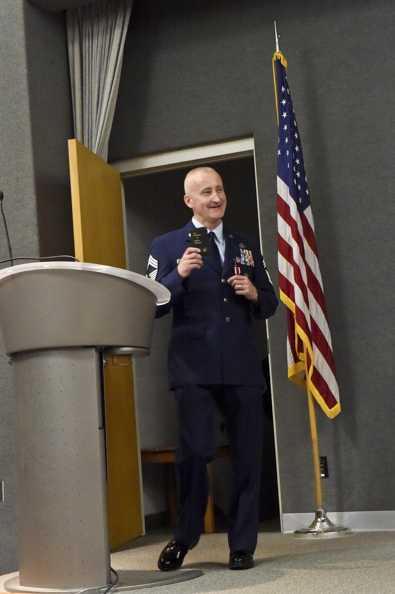 Chief Master Sgt. Rickie King, 434th Security Forces manager, addresses his friends, family and colleagues at a retirement ceremony at Grissom Air Reserve Base, Ind., June 3, 2017. He explained how he kept the same pocket Bible on him at all times since basic training in 1984. (U.S. Air Force photo/ Senior Airman Cali Wetli)