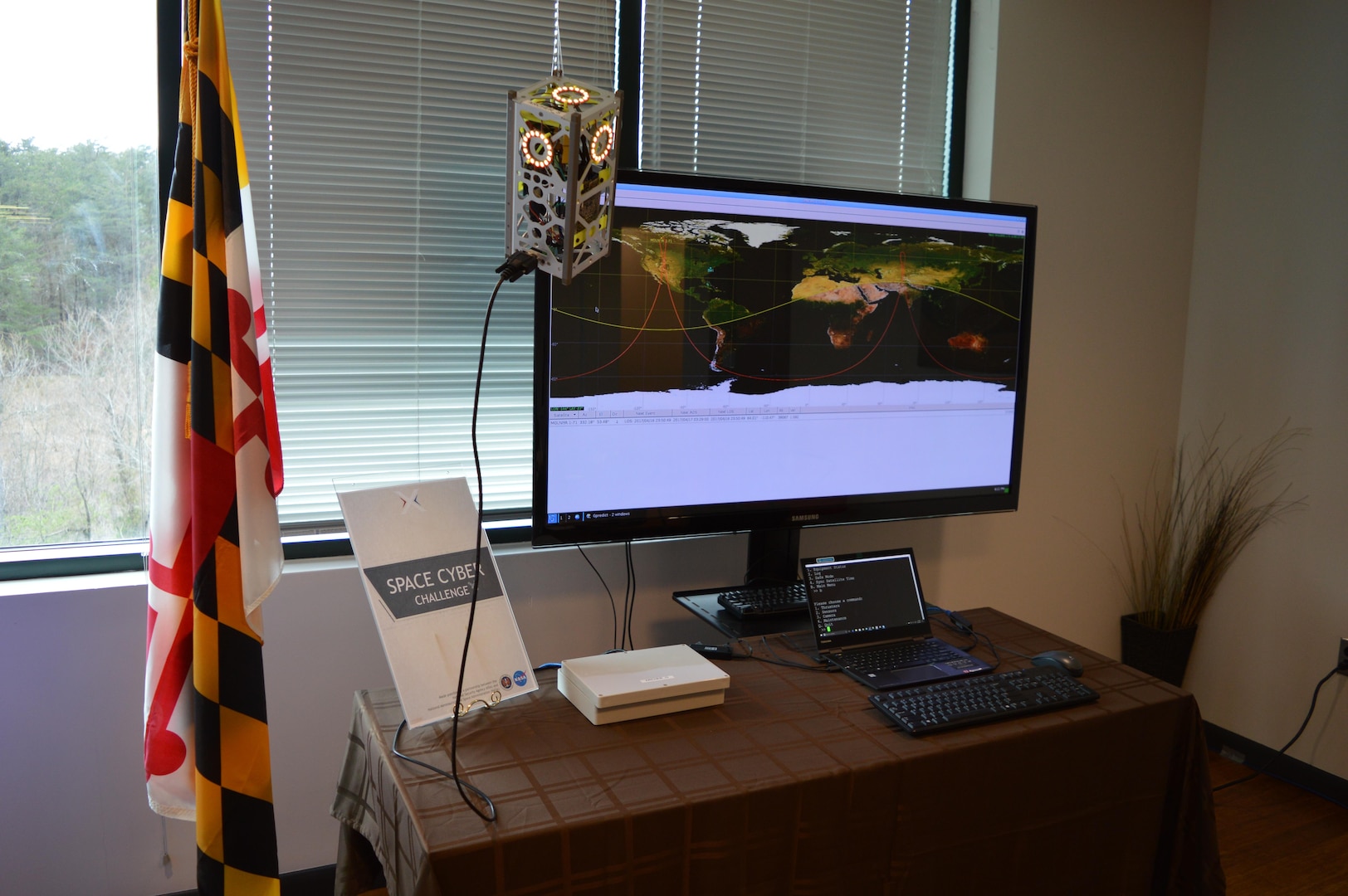 A miniature satellite, or CubeSat, demonstrates its ground segment capability, transmitting signals, as part of the National Security Agencies’ Cyber Space Challenge April 14, 2017. Throughout the week-long challenge, warriors honed their cyber skills and tested their ability to build, secure and defend networks from cyber-attacks. (Courtesy photo)