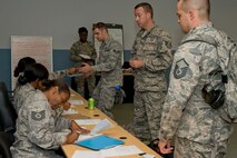 U.S. Air Force Reserve Airmen from the 913th Airlift Group process through the Personnel Deployment Function line June 2, 2017, at Little Rock Air Force Base, Ark. Approximately 45 Airmen from the 913 AG took part in the exercise designed to demonstrate the Group’s ability to deploy and re-deploy a two-ship package carrying passengers and cargo to a simulated deployed location. (U.S. Air Force photo by Master Sgt. Jeff Walston/Released)