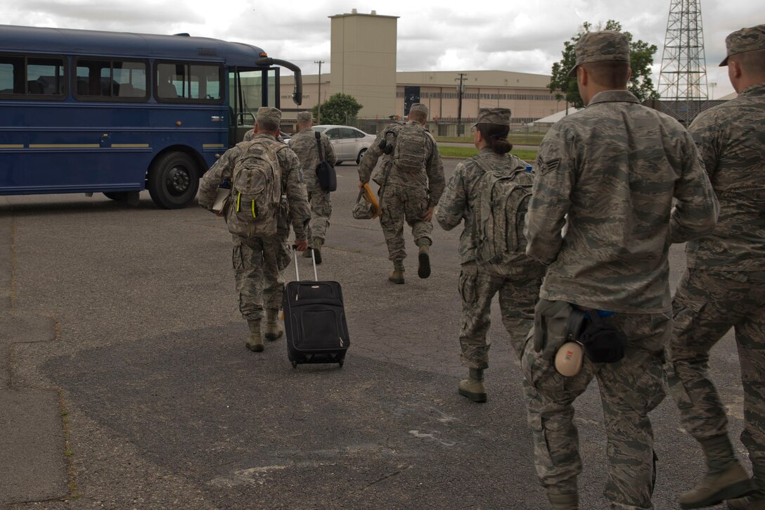 U.S. Air Force Reserve Airmen from the 913th Airlift Group board a bus on their way to a C-130J Super Hercules for a flight to Mississippi June 2, 2017, at Little Rock Air Force Base, Ark. Approximately 45 Airmen from the 913 AG deployed to Mississippi, taking part in the exercise designed to demonstrate the Group’s ability to deploy and re-deploy a two-ship package carrying passengers and cargo to a simulated deployed location. (U.S. Air Force photo by Master Sgt. Jeff Walston/Released)