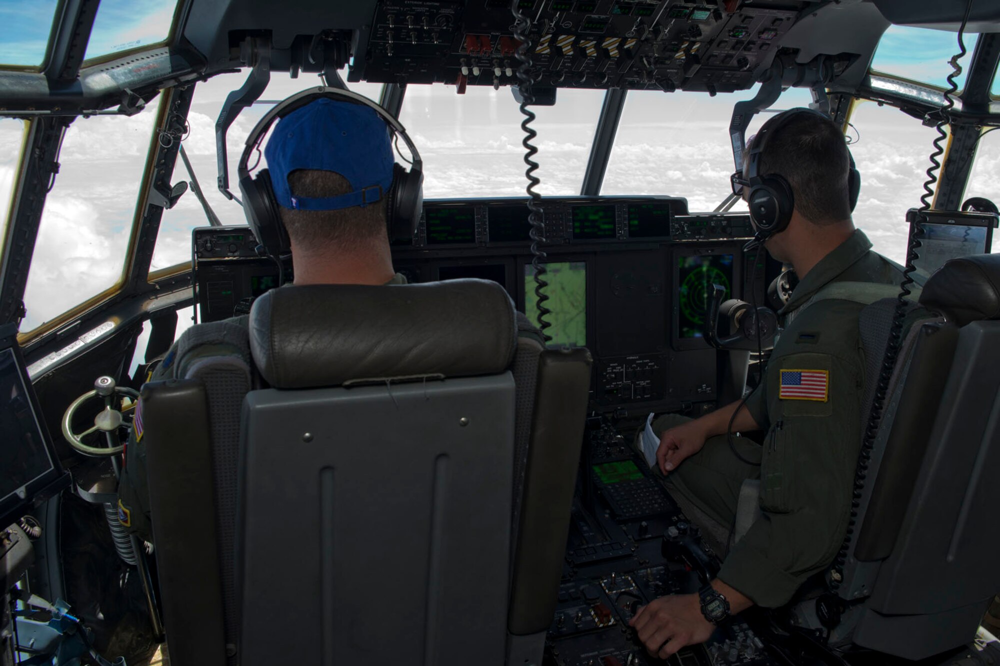 U.S. Air Force Reserve Lt. Col. Chris Dickens, assistant operations office, 327th Airlift Squadron and 1st Lt. Evan Draper, pilot, 327 AS, fly a C-130J Super Hercules from Arkansas to Mississippi June 2, 2017. The two Airmen were transporting passengers and cargo during exercise Prime Horizon, the 913th Airlift Group’s first readiness exercise. (U.S. Air Force photo by Master Sgt. Jeff Walston/Released)