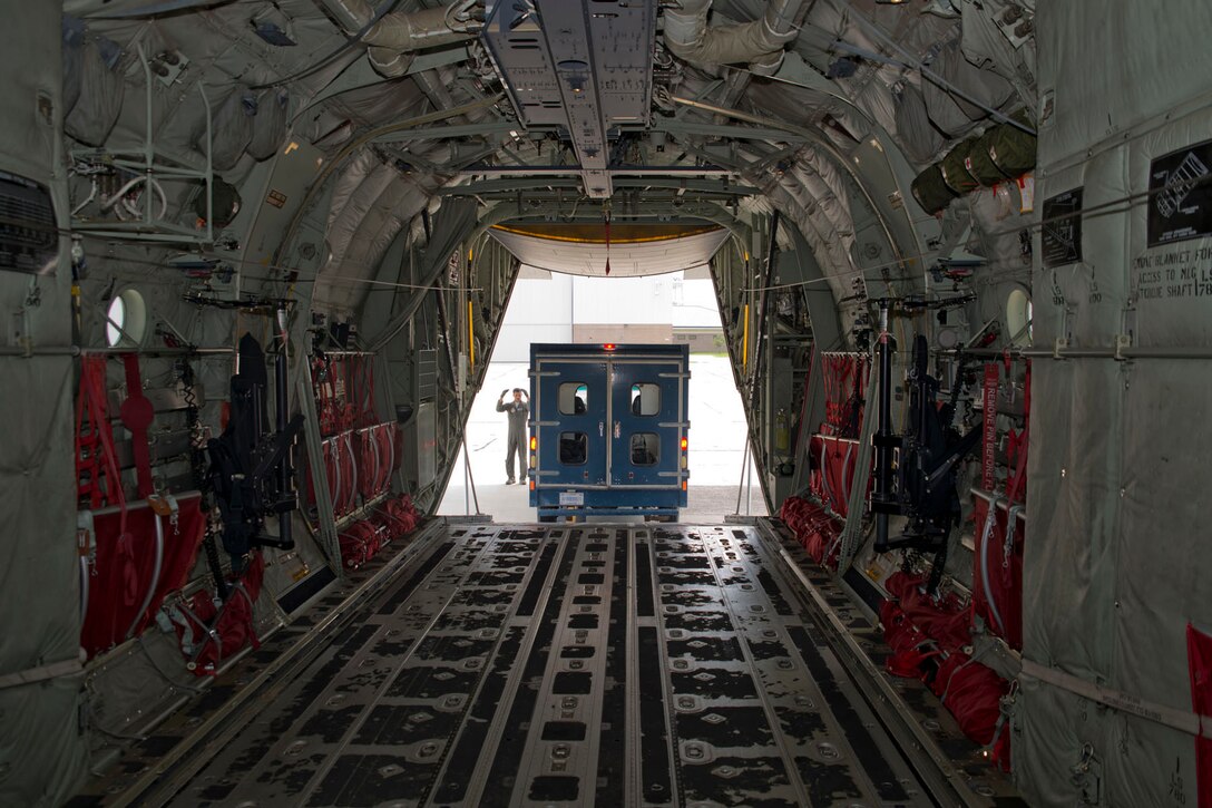 U.S. Air Force Reserve Senior Airman Anthony Miller, loadmaster, 327th Airlift Squadron, directs the off-loading of a bread truck from a C-130J Super Hercules June 2, 2017, at Keesler Air Force Base, Miss. Airmen from the 327 AS and 96th Aerial Port Squadron transported two bread trucks from Little Rock AFB, Ark., to Keesler AFB as part of exercise Prime Horizon. The exercise provided vital training for loadmasters who are responsible for calculating proper weight distribution, loading, securing and escorting cargo and passengers on Air Force flights around the world. (U.S. Air Force photo by Master Sgt. Jeff Walston/Released)