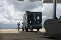 U.S. Air Force Reserve Senior Airman Anthony Miller, loadmaster, 327th Airlift Squadron, directs the loading of a bread truck onto a C-130J Super Hercules June 2, 2017, at Little Rock Air Force Base, Ark. Airmen from the 327 AS and 96th Aerial Port Squadron loaded two C-130Js with bread trucks as part of exercise Prime Horizon. The exercise provided vital training for loadmasters who are responsible for calculating proper weight distribution, loading, securing and escorting cargo and passengers on Air Force flights around the world. (U.S. Air Force photo by Master Sgt. Owen Duke/Released)