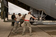 U.S. Air Force Reserve Airmen from the 96th Aerial Port Squadron and 327th Airlift Squadron load a C-130J Super Hercules during Exercise Prime Horizon June 3, 2017, at Keesler Air Force Base, Miss. Approximately 45 Airmen from the 913th Airlift Group deployed to Mississippi, taking part in Prime Horizon, which designed to demonstrate the Group’s ability to deploy and re-deploy a two-ship package carrying passengers and cargo to a simulated deployed location. (U.S. Air Force photo by Master Sgt. Jeff Walston/Released)