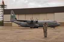 A crew chief from the 913th Aircraft Maintenance Squadron salutes as a C-130J Super Hercules taxis to the runway at Keesler Air Force Base, Miss., June 3, 2017. Maintainers from the 913th MXS provided maintenance support to aircraft at Keesler and Little Rock AFB, during the 913th Airlift Group’s first readiness exercise, which took place at both bases simultaneously. (U.S. Air Force photo by Master Sgt. Jeff Walston/Released)