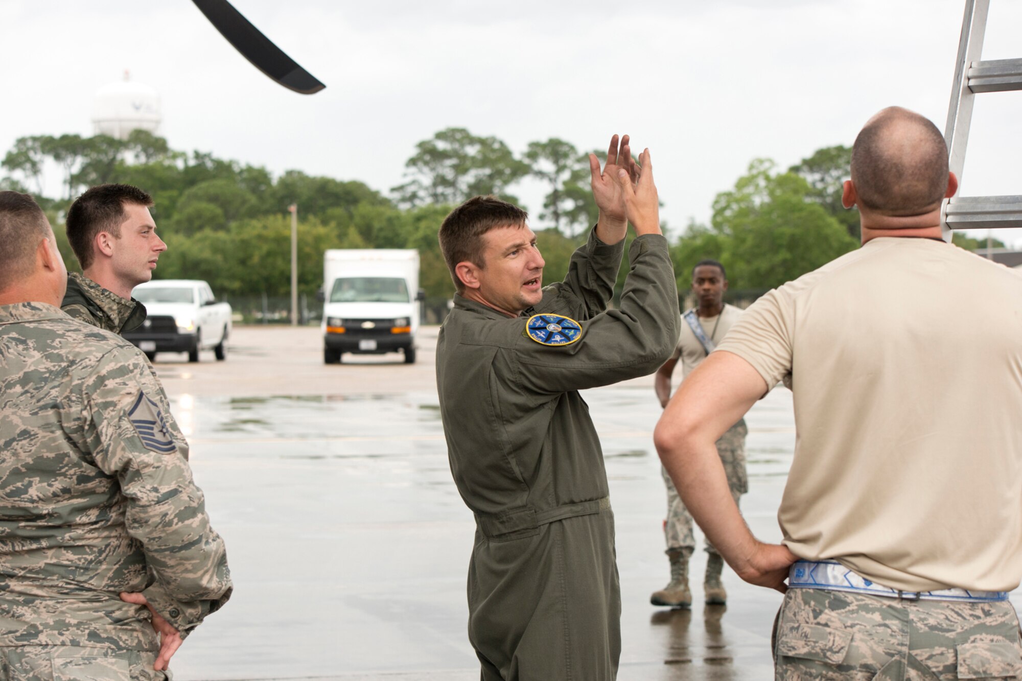 U.S. Air Force Reserve Tech Sgt. Nate Castle, loadmaster, 327th Airlift Squadron, has a discussion with maintenance personnel under the wing of a C-130J Super Hercules during exercise Prime Horizon at Keesler Air Force Base, Miss., June 3, 2017. Communication between aircrews and maintenance personnel are essential to ensure everything and everyone is safe and secure on Air Force flights. (U.S. Air Force photo by Master Sgt. Jeff Walston/Released)