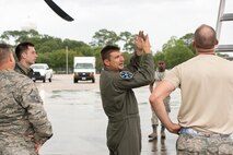U.S. Air Force Reserve Tech Sgt. Nate Castle, loadmaster, 327th Airlift Squadron, has a discussion with maintenance personnel under the wing of a C-130J Super Hercules during exercise Prime Horizon at Keesler Air Force Base, Miss., June 3, 2017. Communication between aircrews and maintenance personnel are essential to ensure everything and everyone is safe and secure on Air Force flights. (U.S. Air Force photo by Master Sgt. Jeff Walston/Released)