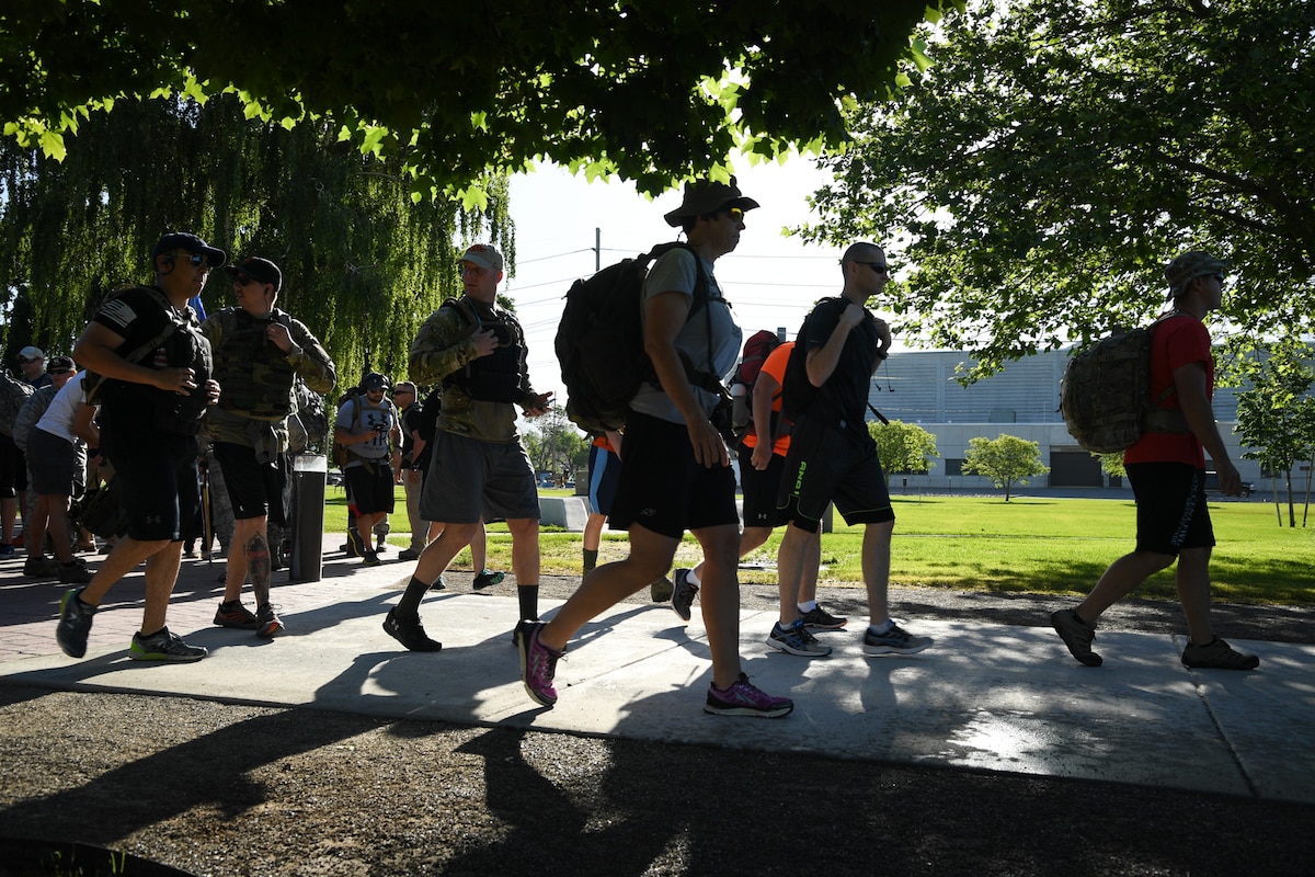 Team Hill personnel begin a ruck march from Hill Air Force Base’s Memorial Park, June 9. The 10th annual ruck march honored Air Force Office of Special Investigations Special Agent (Tech. Sgt.) Ryan Balmer, who was killed in Iraq in 2007. (U.S. Air Force/R. Nial Bradshaw)