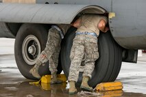 Crew chiefs assigned to the 913th Maintenance Squadron check the brakes after recovering a C-130J Super Hercules during exercise Prime Horizon June 3, 2017, at Keesler Air Force Base, Miss. Maintainers from the 913th MXS provided maintenance support to aircraft at Keesler and Little Rock AFB, Ark., during the 913th Airlift Group’s first readiness exercise with took place simultaneously at both bases. (U.S. Air Force photo by Master Sgt. Jeff Walston/Released)