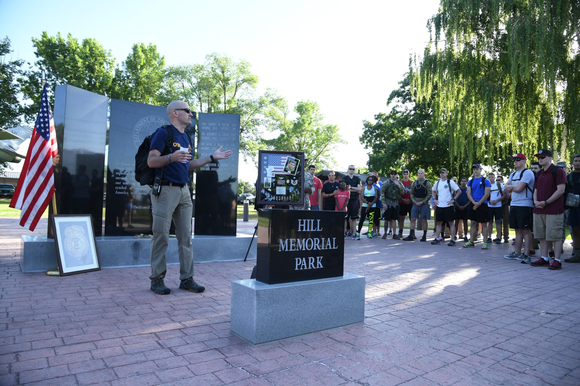 Special Agent Michael Bryant, AFOSI Detachment 113 commander, greets participants before a ruck march, which began at Hill Air Force Base’s Memorial Park, June 9. The 5K and 10-mile ruck marches were conducted in honor of SA Ryan Balmer, who was killed in Iraq in June 2007. SA Balmer was deployed from Hill AFB. (U.S. Air Force/R. Nial Bradshaw)