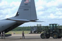 U.S. Air Force Reserve Airmen from the 96th Aerial Port Squadron and 327th Airlift Squadron load a C-130J Super Hercules during Exercise Prime Horizon June 3, 2017, at Little Rock Air Force Base, Ark. More than 45 Airmen from the 913th Airlift Group deployed to Keesler AFB, Miss., to take part in the exercise demonstrating the Group’s ability to deploy and re-deploy passengers and cargo to a simulated deployed location. (U.S. Air Force photo by Airman 1st Class Codie Collins/Released)