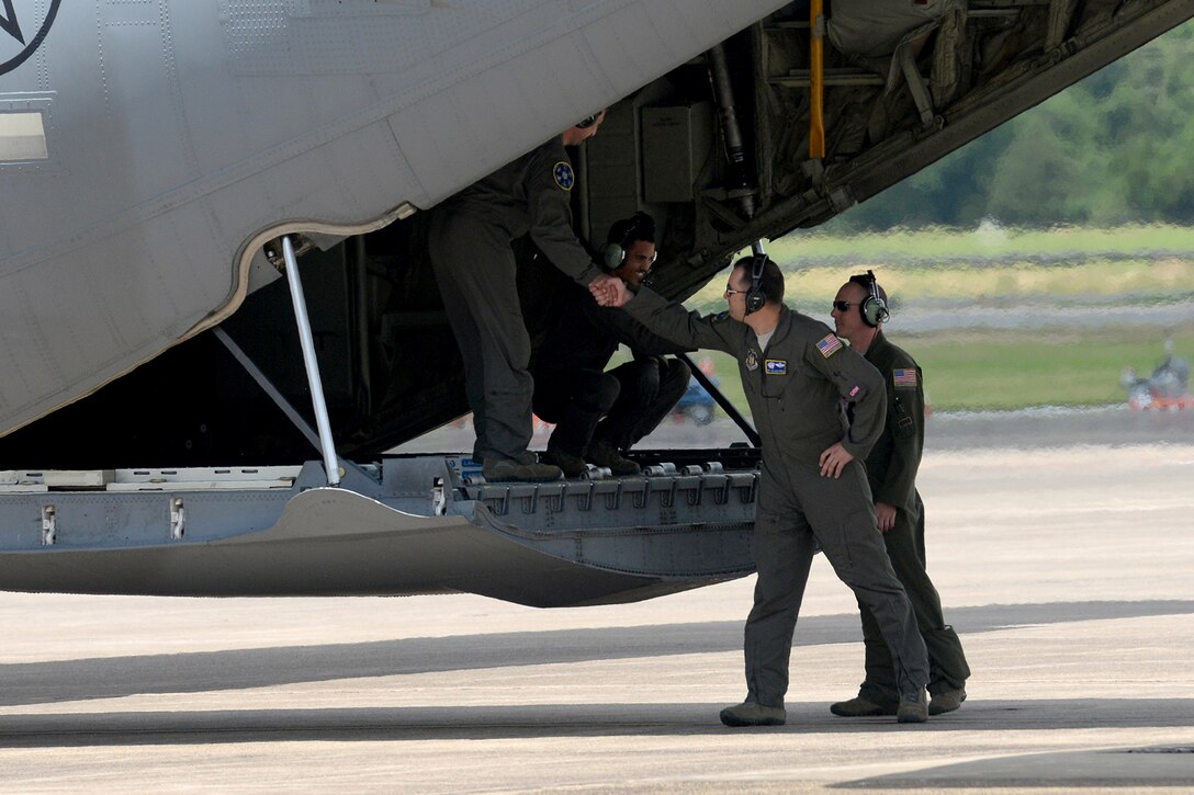 U.S. Air Force Reserve loadmasters assigned to the 327th Airlift Squadron, congratulate each other after a successful evolution during exercise Prime Horizon June 3, 2017, at Little Rock Air Force Base, Ark. Prime Horizon brought all six squadrons of the 913th Airlift Group together for the first time to work as a team during the readiness exercise, which took place simultaneously at both Little Rock and Keesler Air Force Base, Miss. (U.S. Air Force photo by Airman 1st Class Codie Collins/Released)