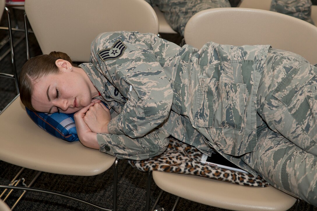 U.S. Air Force Reserve Staff Sgt. Ashley Ritchey, a 96th Aerial Port Squadron passenger services journeyman, sleeps while waiting for a flight June 4, 2017, at Keesler Air Force Base, Miss. Ritchey was part of a detachment of Airmen from the 913th Airlift Group that deployed to Mississippi to take part in an exercise demonstrating the Group’s ability to deploy and re-deploy a two-ship package carrying passengers and cargo to a simulated deployed location. (U.S. Air Force photo by Master Sgt. Jeff Walston/Released)