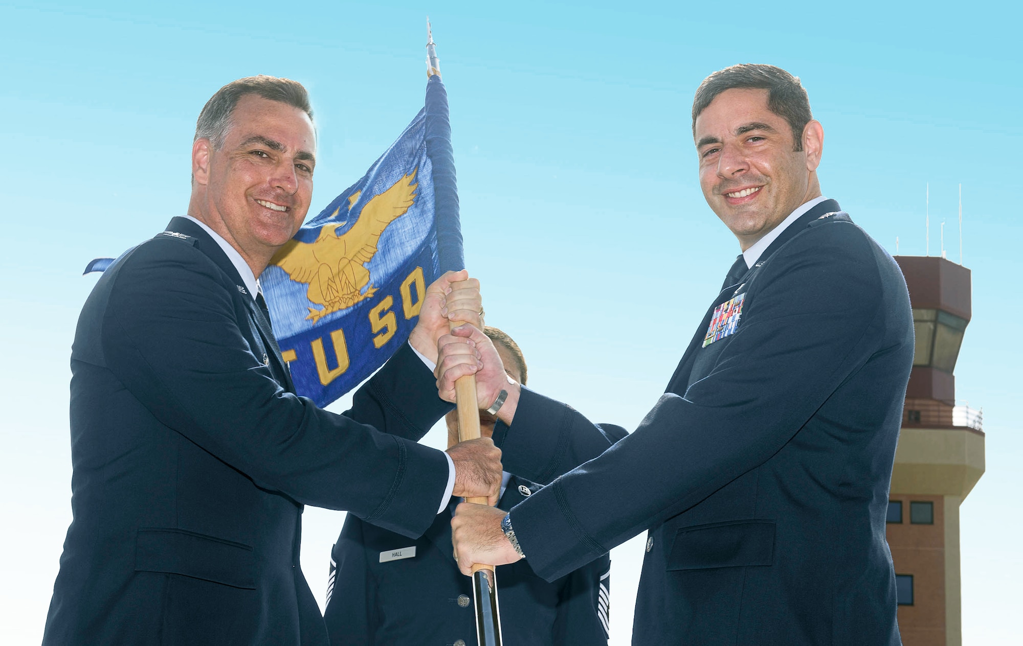 Lt. Col. Alexander Heyman, right, accepts the 71st Student Squadron guidon from Col. Paul Johnson, 71st Operations Group commander, during a change-of-command ceremony June 1 on the flightline at Vance Air Force Base, Oklahoma. (U.S. Air Force photo/ Terry Wasson)