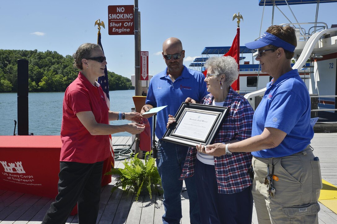 Diane Parks, chief of operations, U.S. Army Corps of  Engineers, Nashville District, presents a certificate, and thanked (l to r) Frank, Pat and Patty Brendel for their work in taking the initiative to achieve “Clean Marina” status and presented the “Clean marina” flag.



