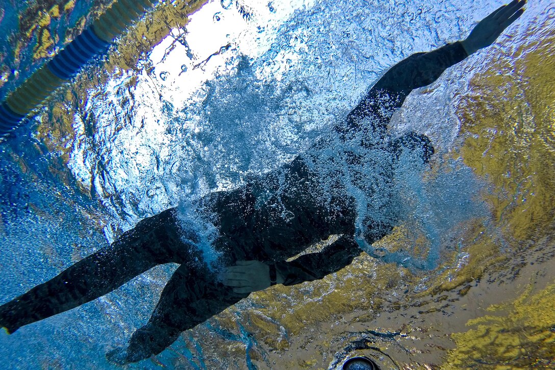 An airman swims a 100-meter challenge during a test for the German Armed Forces Badge for Military Proficiency at Joint Base McGuire-Dix-Lakehurst, N.J., June 13, 2017. The airman is assigned to the New Jersey Air National Guard's 108th Security Forces Squadron. Air National Guard photo by Master Sgt. Matt Hecht